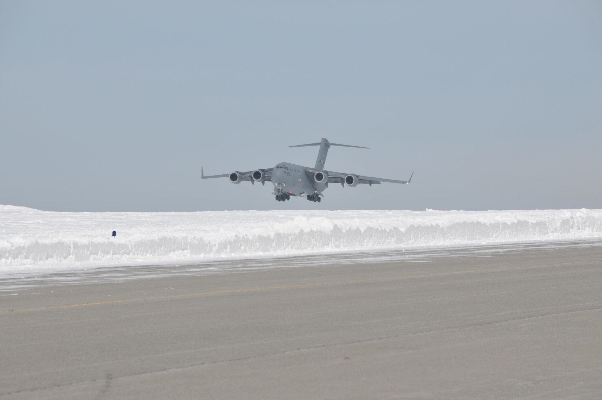 A C-17 Globemaster III from Stewart Air National Guard Base brought about 30 Airmen home to Stratton Air National Guard Base, Scotia, New York, on Feb. 24, 2015. The Airmen were in Antarctica supporting Operation Deep Freeze. More Airmen and LC-130 Hercules ski-equipped aircraft assigned to the 109th Airlift Wing will return throughout the week following the close of the wing's 27th year supporting the National Science Foundation. The season began in October. (U.S. Air National Guard photo by Master Sgt. William Gizara/Released)