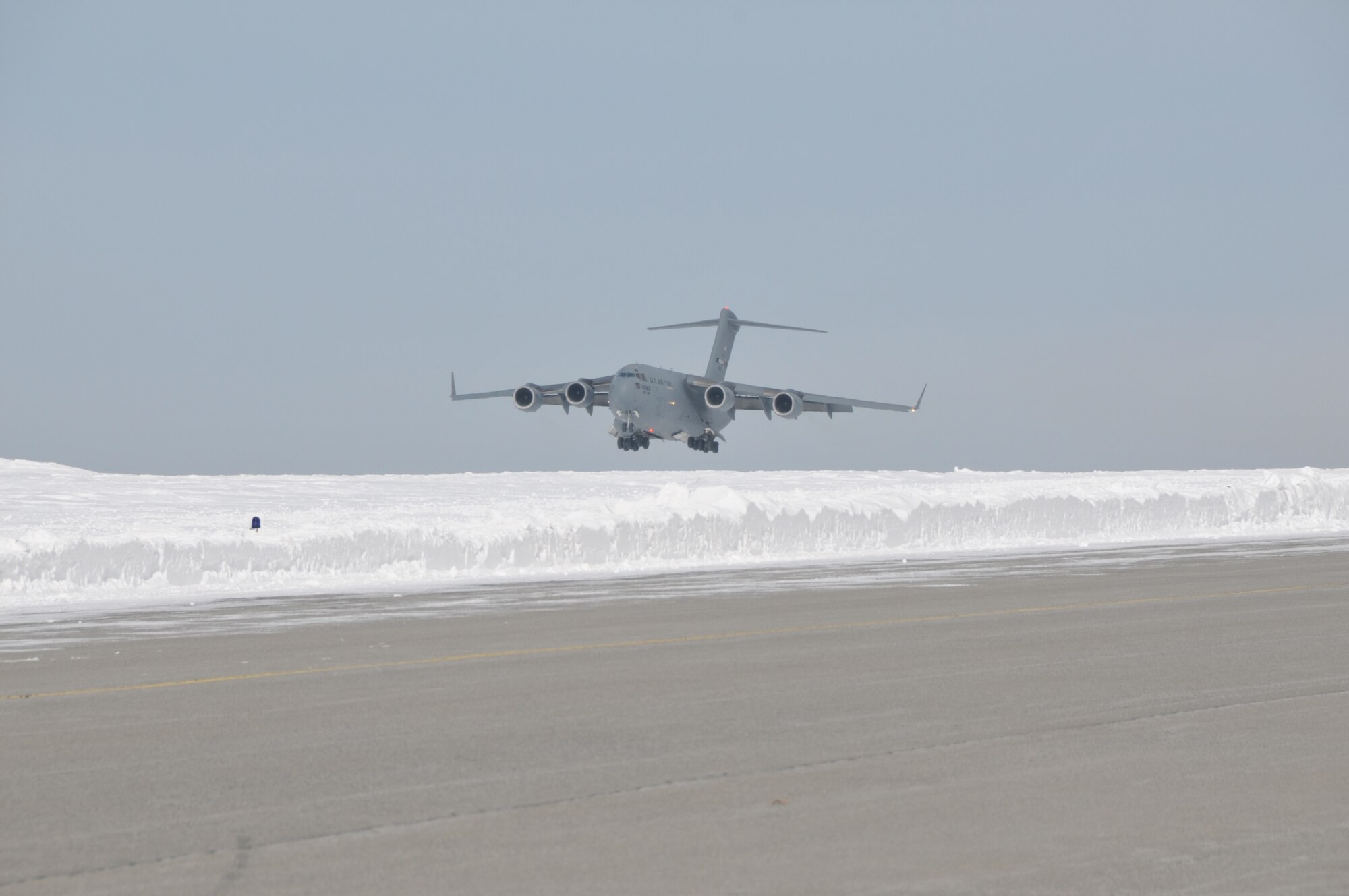 A C-17 Globemaster III from Stewart Air National Guard Base brought about 30 Airmen home to Stratton Air National Guard Base, Scotia, New York, on Feb. 24, 2015. The Airmen were in Antarctica supporting Operation Deep Freeze. More Airmen and LC-130 Hercules ski-equipped aircraft assigned to the 109th Airlift Wing will return throughout the week following the close of the wing's 27th year supporting the National Science Foundation. The season began in October. (U.S. Air National Guard photo by Master Sgt. William Gizara/Released)