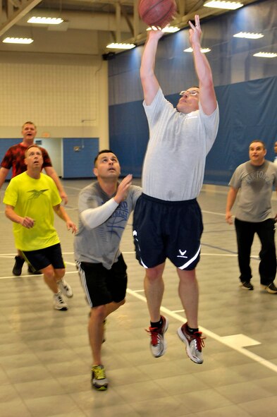 MCGHEE TYSON AIR NATIONAL GUARD BASE, Tenn. - Master Sgt. Matt Schwartz makes a jump shot. Airmen and civilian staff from all three divisions at the I.G. Brown Training and Education Center joined at Wilson Hall here Feb. 25 for a basketball game. (U.S. Air National Guard photo by Master Sgt. Mike R. Smith/Released)