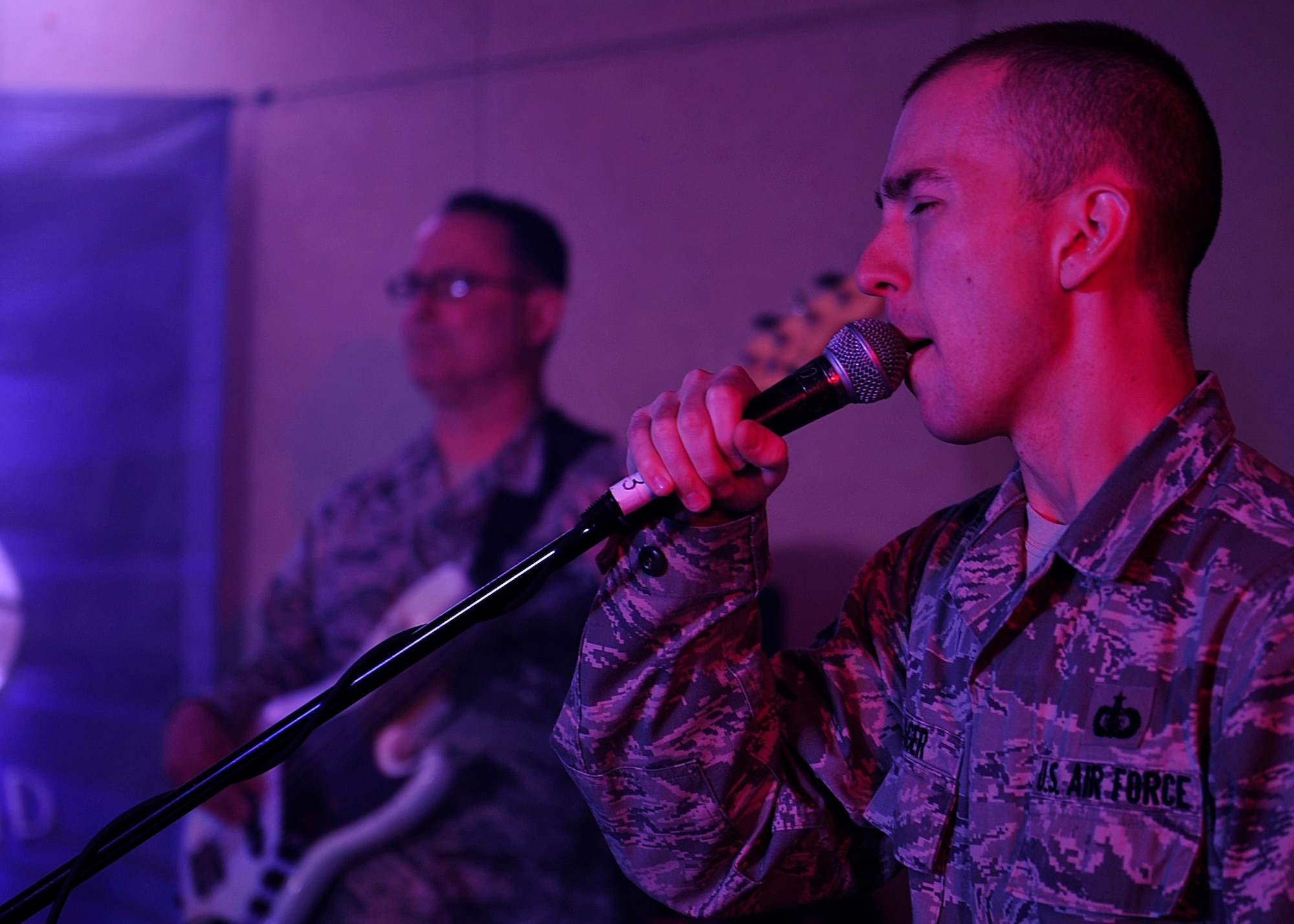 U.S. Air Force Staff Sgt. Ryan Rager, Heritage of America Band Blue Aces, pianist and vocalist, sings during a musical performance at Langley Air Force Base, Va., Feb. 12, 2015. The Blue Aces provide specialized, high-energy performances that feature a wide variety of American popular music styles. (U.S. Air Force photo by Airman 1st Class Breonna Veal/Released)