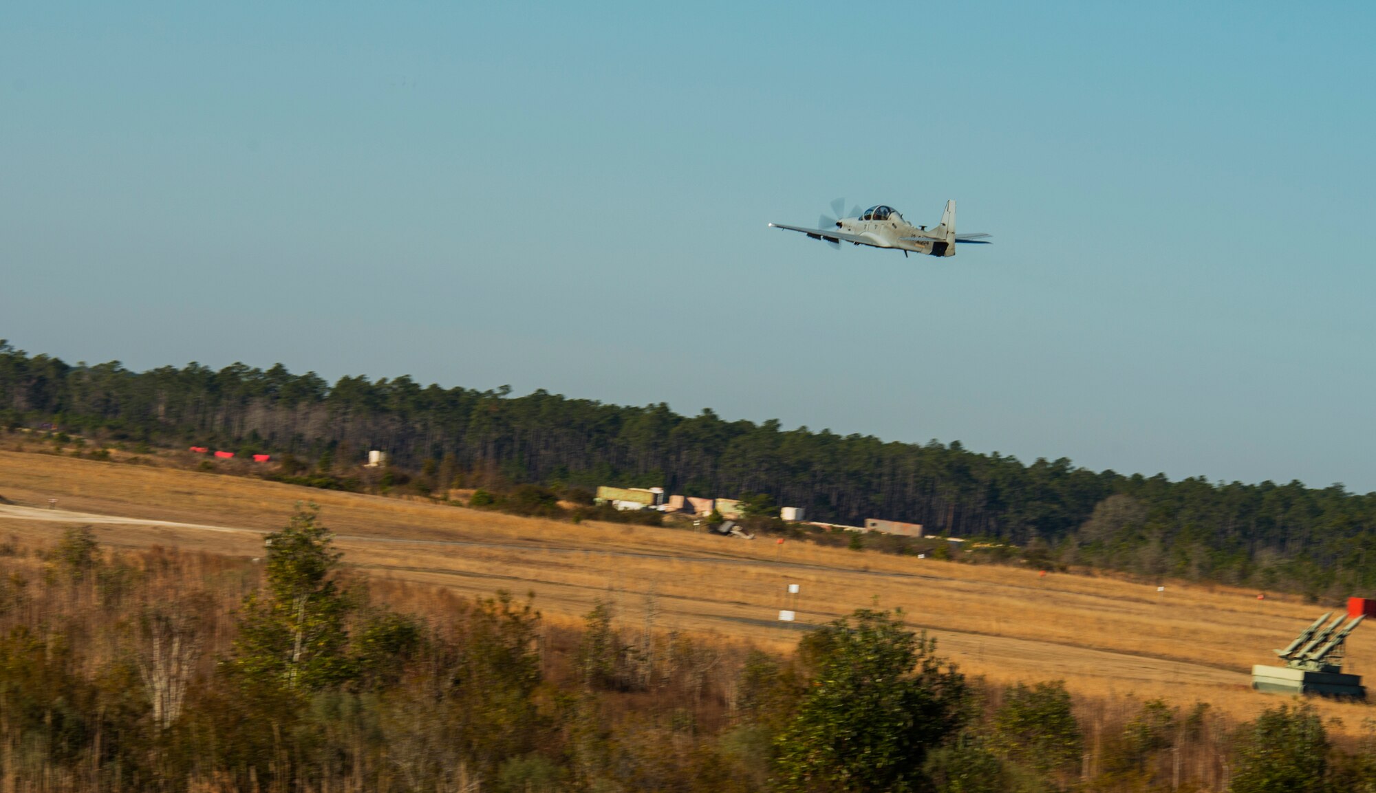 An A-29 Super Tucano maneuvers during a light air support training Feb. 20, 2015, at Moody Air Force Base, Ga. The A-29 will be used to train 30 Afghan pilots and 90 Afghan maintainers. (U.S. Air Force photo by Airman 1st Class Ceaira Tinsley/Released)