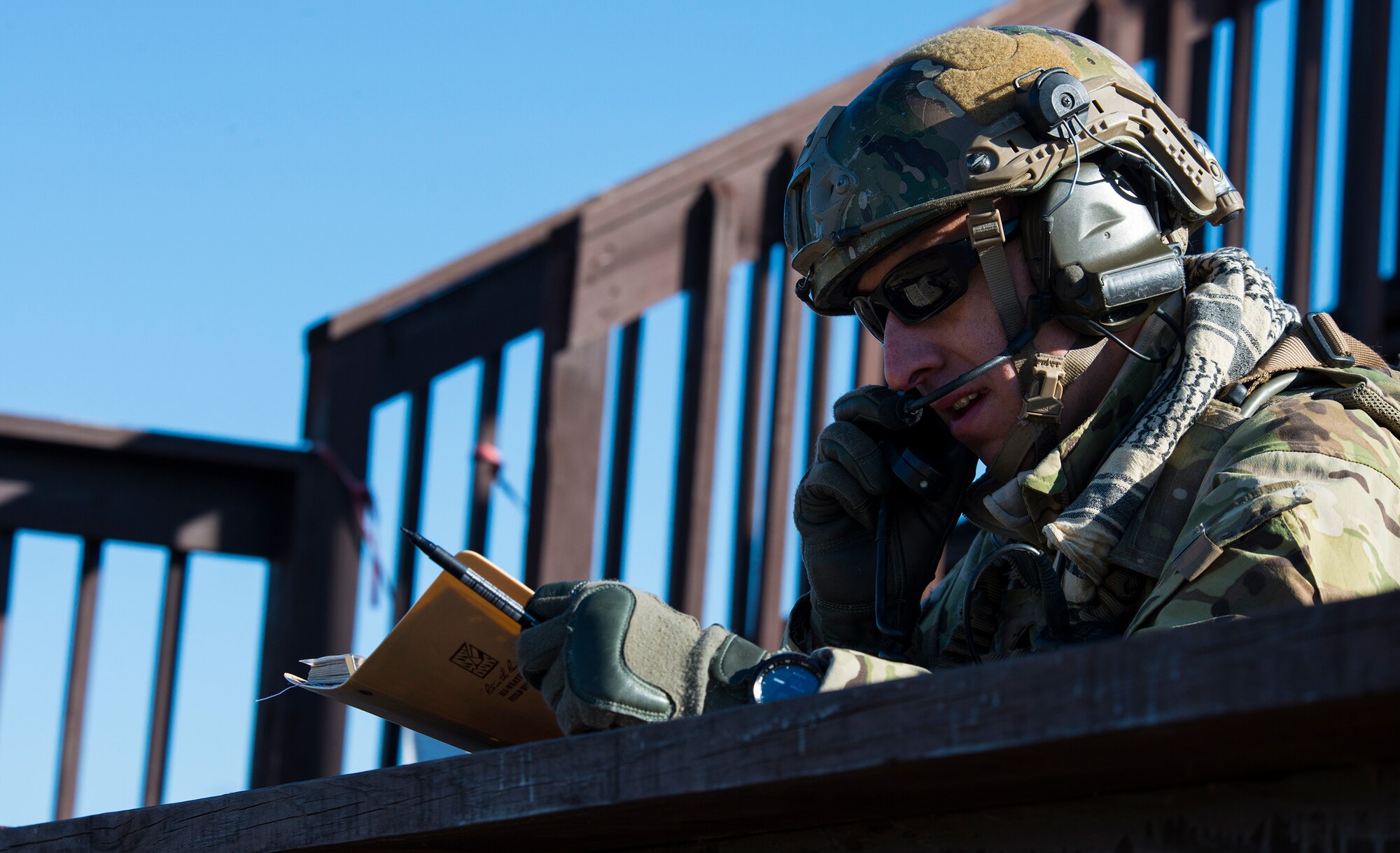 U.S. Air Force Capt. Brian Leen, 7th Air Support Operations Squadron air liaison officer, out of Fort Bliss, Texas, calls in an airstrike during a light air support training Feb. 20, 2015, at Moody Air Force Base, Ga. Joint terminal attack controllers act as liaisons between aircrew members and ground forces. (U.S. Air Force photo by Airman 1st Class Ceaira Tinsley/Released)