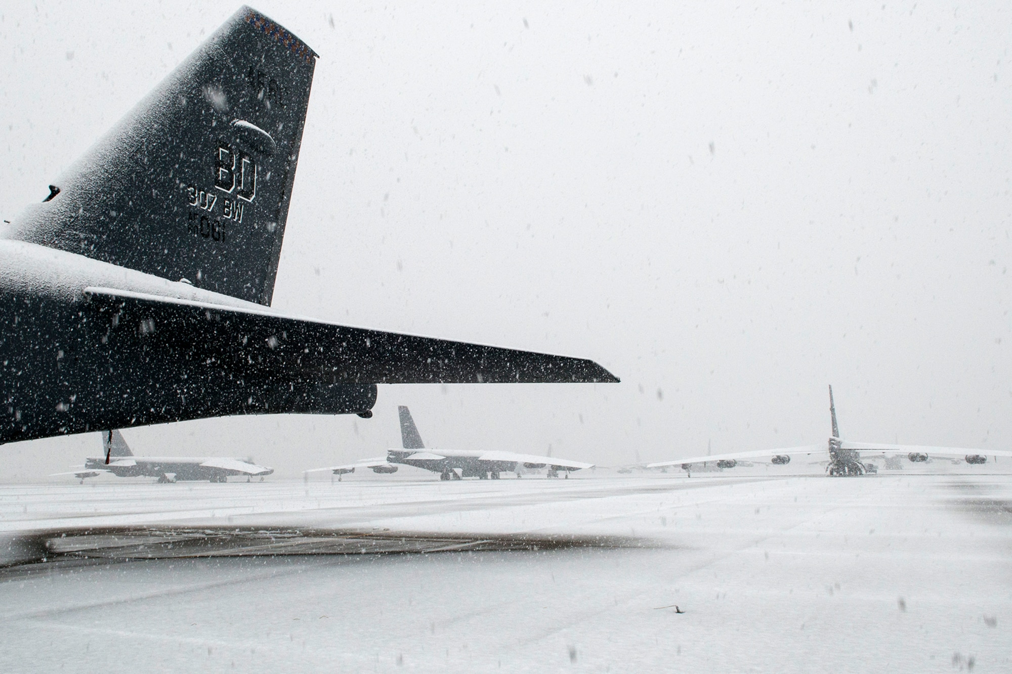 A group of Air Force Reserve B-52H Stratofortress bombers, assigned to the 307th Bomb Wing, slowly turned white on the flight line  Feb. 25, 2015, Barksdale Air Force Base, La. A band of winter weather hit Barksdale and the surrounding area bringing ice and a few inches of snow. (U.S. Air Force photo by Master Sgt. Greg Steele/Released)