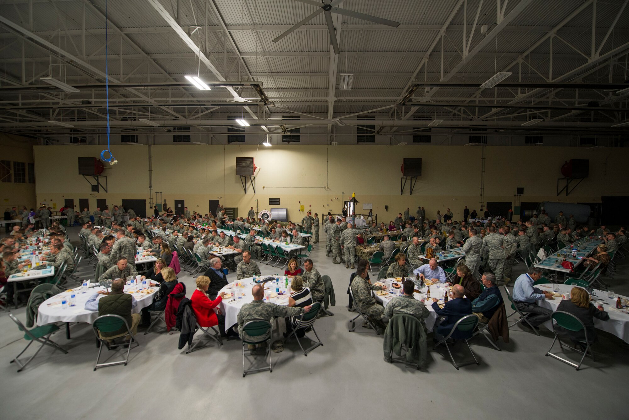 Team Moody members socialize during the 2015 Maintenance Professional of the Year awards ceremony Feb. 20, 2015, at Moody Air Force Base, Ga. More than 450 Team Moody members attended the ceremony to recognize the 23d Maintenance Group Airmen selected for an award. (U.S. Air Force photo by Airman 1st Class Dillian Bamman/Released)