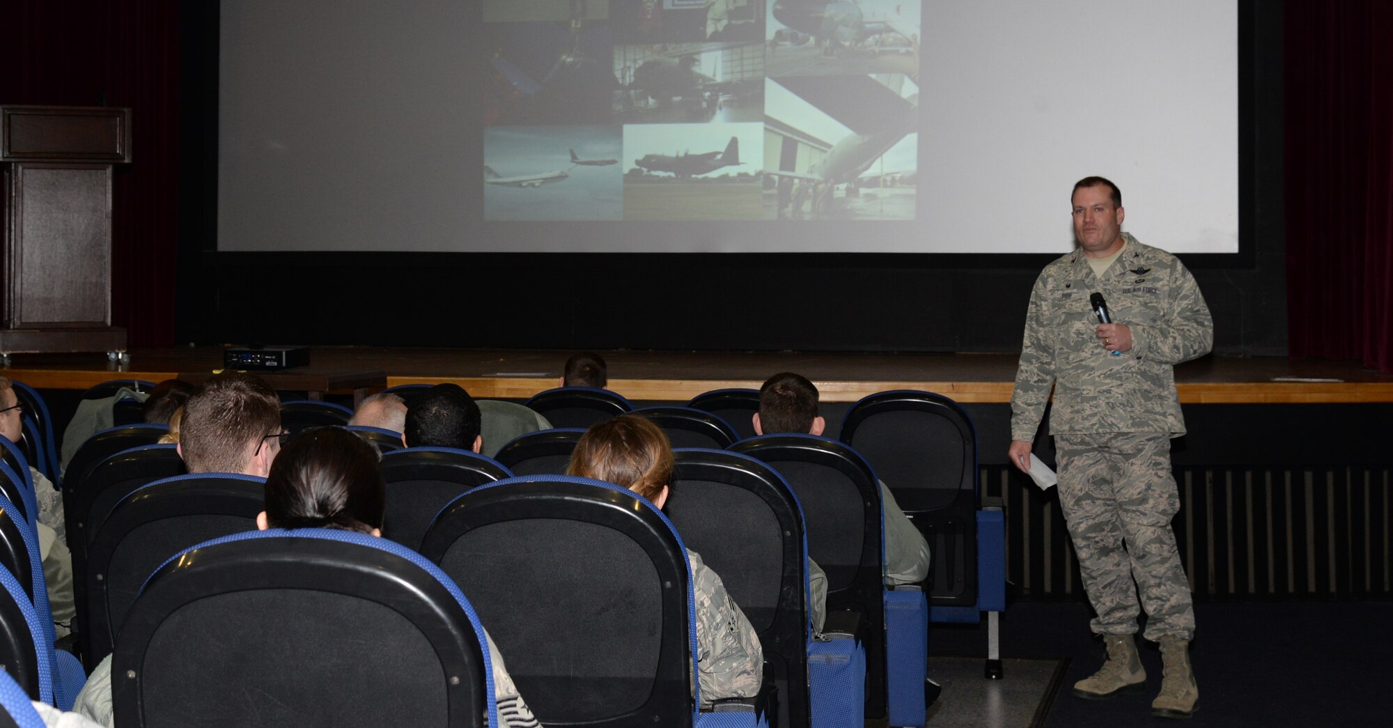 U.S. Air Force Col. Kenneth T. Bibb Jr., 100th Air Refueling Wing commander, speaks to Airmen during a commander’s call Feb. 24, 2015, at the base theater on RAF Mildenhall, England. Bibb focused on showing Airmen the importance of missions they accomplish every day, and urged them to keep up the good work. (U.S. Air Force photo by Airman 1st Class Jonathan Light/Released)