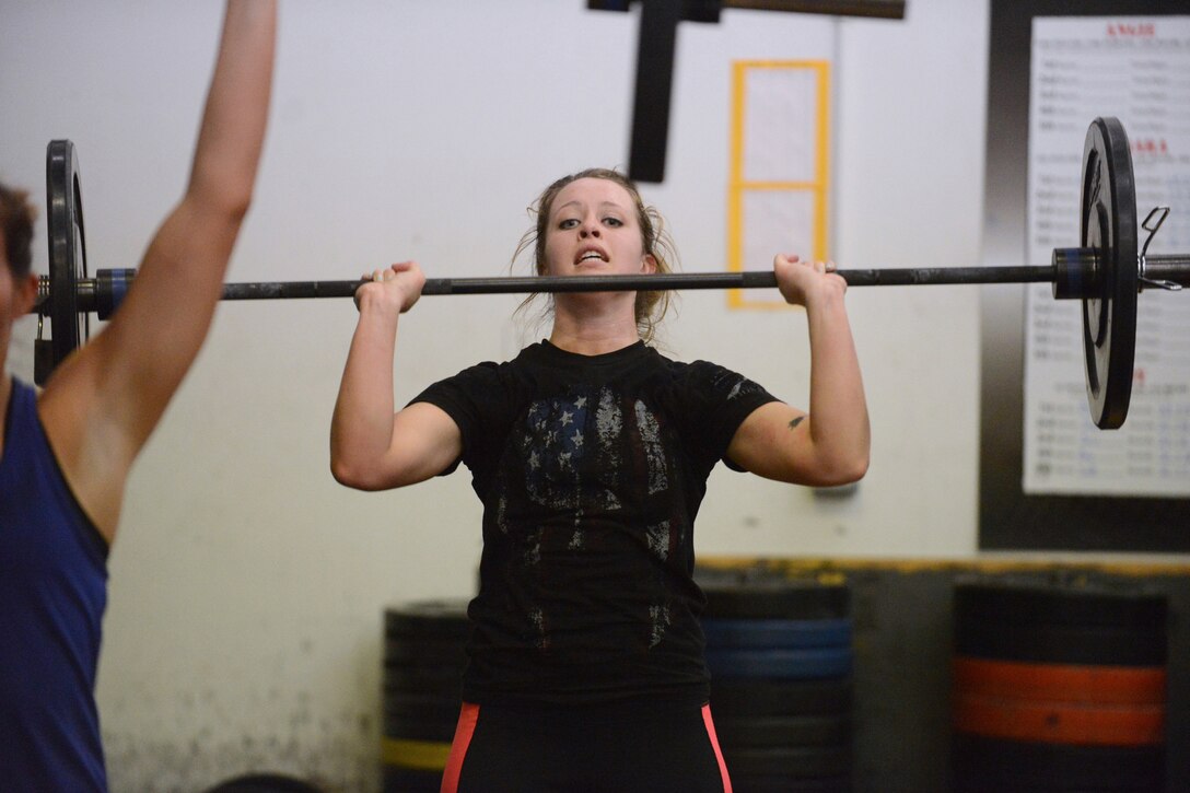 Senior Airman Devon Brekke, of the 119th Maintenance Squadron, lifts weights as she participates in a fitness challenge to raise awareness and funds for veterans’ causes Feb. 22, 2015, Fargo, North Dakota. Brekke organized the fund raising event at a local gym. The new year is a popular time to renew fitness efforts and correlate them with a good cause among military members. (U.S. Air National Guard photo by Senior Master Sgt. David H. Lipp/Released)