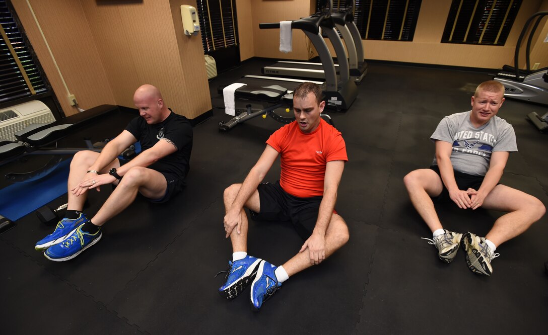 U.S. Air Force band, Max Impact members conduct butterfly sit-ups during circuit training at the Holiday Inn Hotel and Suites gym in Mesa, Ariz., Jan. 31, 2015. The band finds various work-outs between high intensity interval training, circuits, weight lifting and running to maintain their fitness goal to be the fittest U.S. Air Force Band unit.  (U.S. Air Force photo/ Senior Airman Nesha Humes)