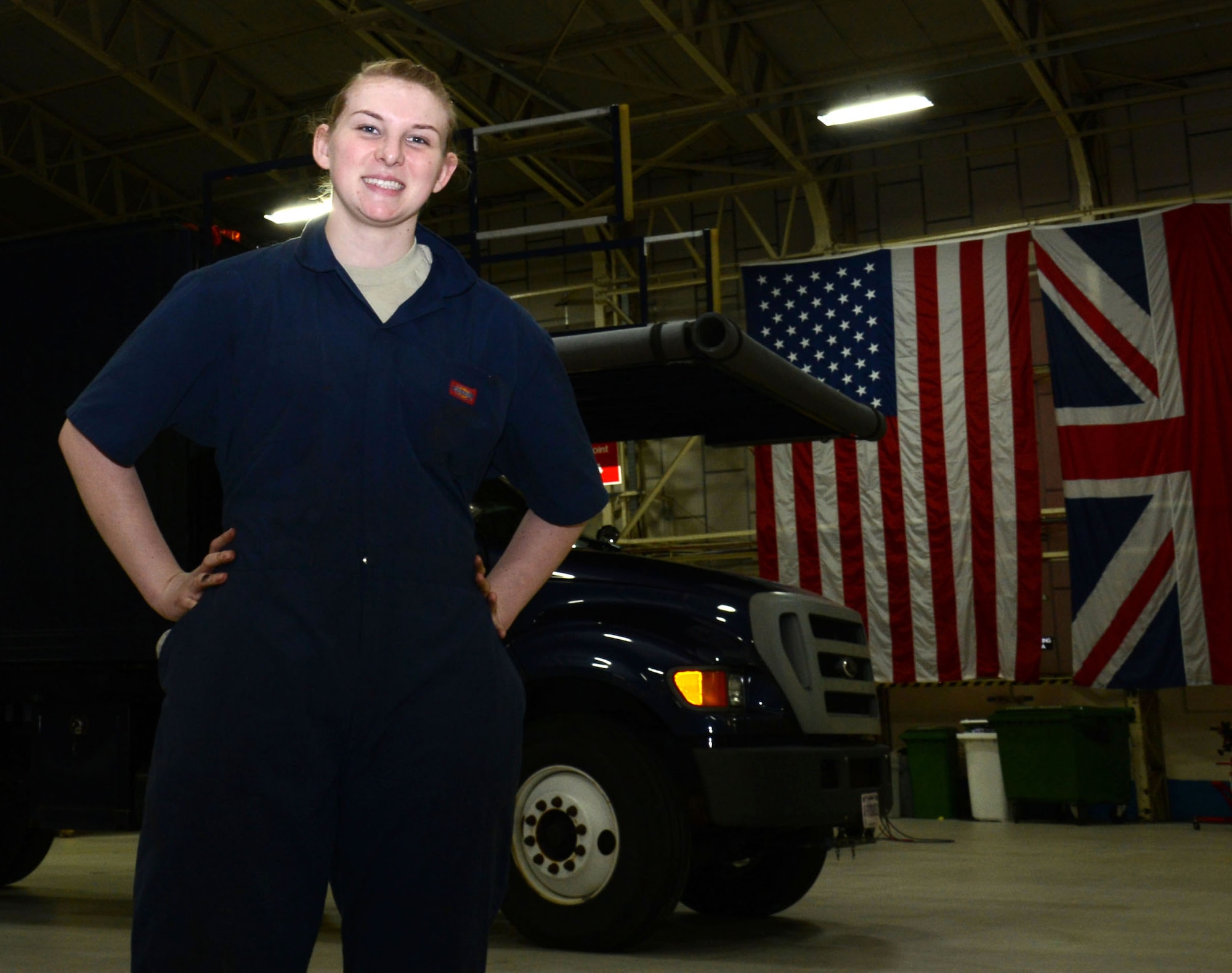 U.S. Air Force Airman 1st Class Carly Reuter, 100th Logistics Readiness Squadron Vehicle Maintenance journeyman from Grangeville, Idaho, poses for a photograph in her shop Feb. 4, 2015, on RAF Mildenhall, England. In her spare time Reuter enjoys traveling around the United Kingdom and Europe. (U.S. Air Force photo by Gina Randall/Released)