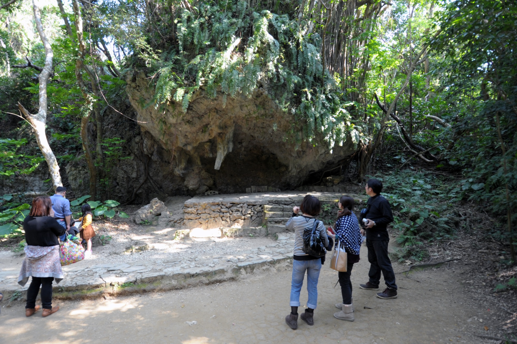 Tourists visit an altar at Sefa-Utaki, on Okinawa, Japan, Feb. 21, 2015. Sefa-Utaki, one of Okinawa’s most significant religious sites, provides a great day trip for those looking to explore the island. (U.S. Air Force photo by Tim Flack)