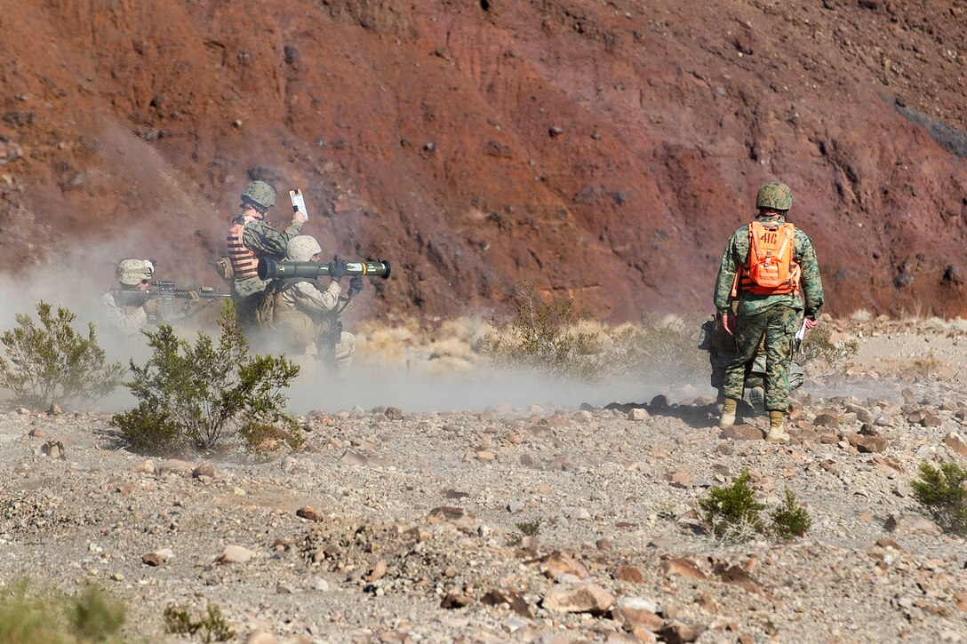 Marines prepare to fire an AT4 antitank grenade launcher as they receive instructions from Marines assigned to a tactical training control group as part of Integrated Training Exercise 2-15 at the Marine Corps Air Ground Combat Center in Twentynine Palms, Calif., Feb. 15, 2015.
