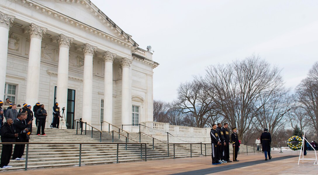 Army Maj. Gen. Jeffrey S. Buchanan and Golden State Warriors members David Lee, Andre Iguodala and Stephen Curry prepare to lay a wreath at the Tomb of the Unknown Soldier at Arlington National Cemetery in Arlington, Va., Feb. 25, 2015, as part of "Commitment to Service," the Defense Department's partnership with the NBA.