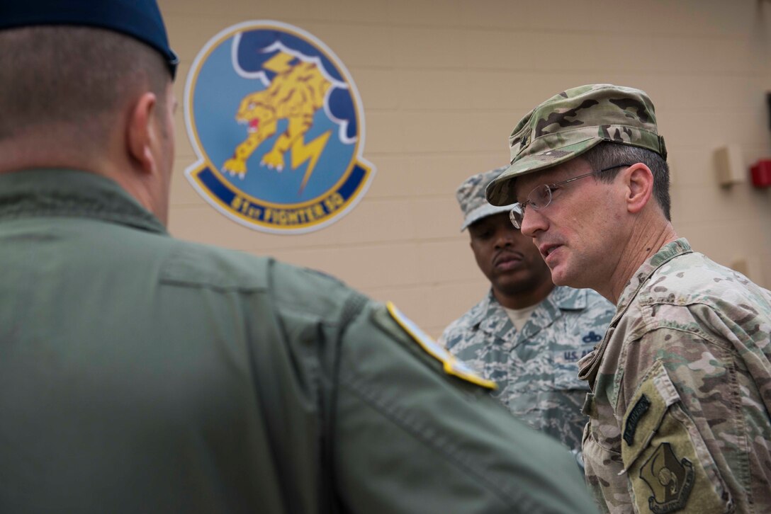 U.S. Air Force Brig. Gen. Michael Rothstein, right, Train, Advise, Assist Command-Air commanding general, speaks with Airmen from the 81st Fighter Squadron Feb. 23, 2015, at Moody Air Force Base, Ga about the progression of the A-29 flying program. Rothstein was stationed at Moody as the 69th Fighter Squadron chief of weapons and tactics from and recently returned to see the squadrons efforts in training Afghan Air Force pilots in support of the A-29 program. (U.S. Air Force photo by Airman 1st Class Dillian Bamman/Released)