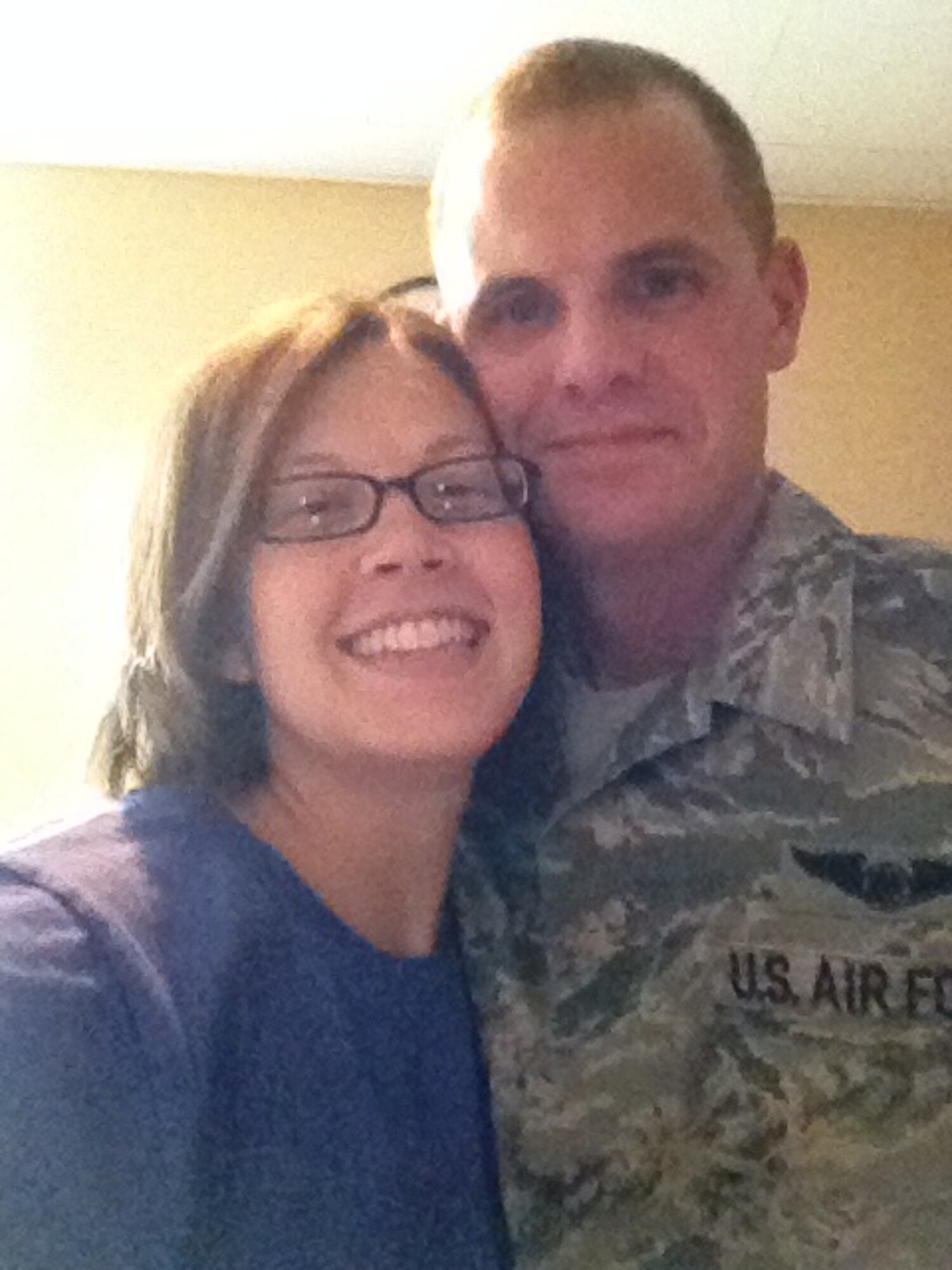 Staff Sgt. Phillip Steffen and his wife, Jamie Steffen, pose for a photo after he returned from a six-month deployment to Southwest  Asia, July 22, 2014, at Lutheran Hospital in Ft. Wayne, Indiana before going to the neonatal intensive care unit to meet his daughter. Jamie gave birth to their third daughter four weeks premature 25 hours prior to Steffen’s arrival. (Courtesy photo)