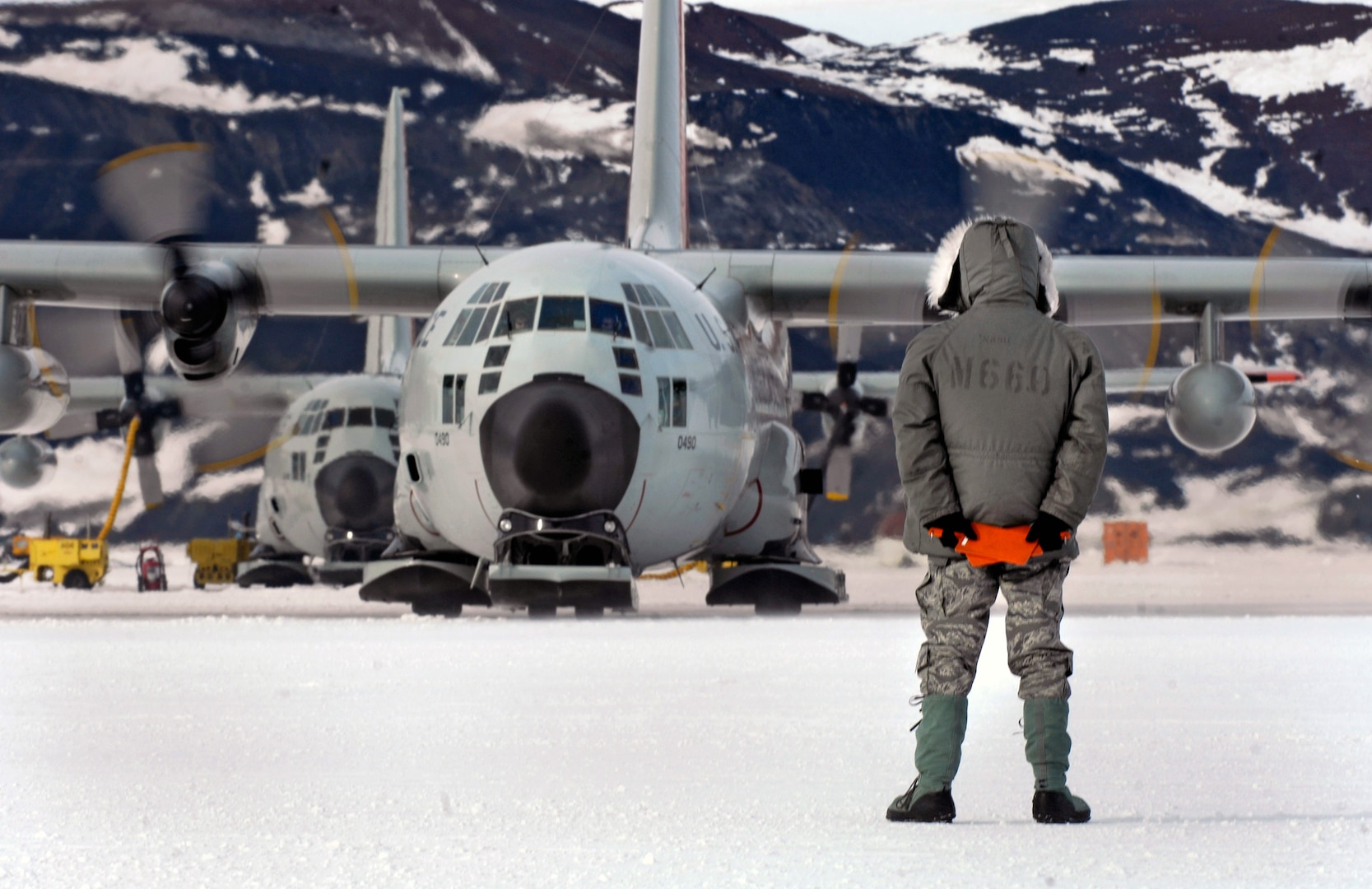 Tech. Sgt. Kevin Call waits to marshal an LC-130 Hercules from the New York Air National Guard’s 109th Airlift Wing to a parking spot on the annual sea ice runway Nov. 26, 2007 near McMurdo Station, Antarctica, during Operation Deep Freeze. The 109th AW recently wrapped up its 27th season of flying the ski-equipped LC-130 in support of the operation, which provides military logistics support to the National Science Foundation’s Antarctic Program. The wing is the only unit in the U.S. military equipped with the LC-130 “Skibirds.” 