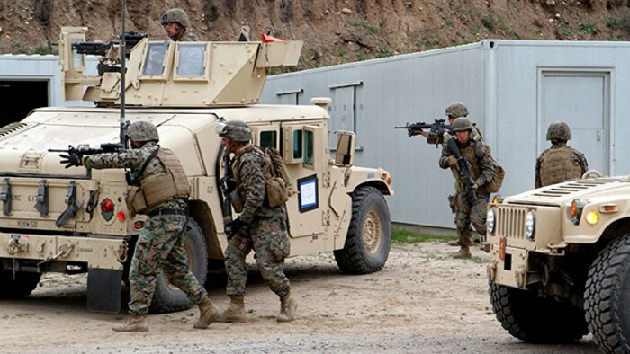 The QRF security element posts up four-corner security around an objective site during a Quick Reaction Force drill, as part of Marine Expeditionary Force Exercise 2015 aboard Camp Pendleton, Calif., Feb. 22, 2015. Marines with 1st Law Enforcement Battalion employed a QRF to combat imminent “enemy threats” during MEFEX-15.