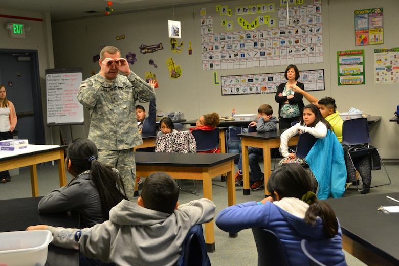 WINCHESTER, Va. - Brig. Gen. Robert Carlson answers questions from the 4th grade class attending STARBASE Academy Winchester, Feb. 10, as STARBASE Director Susan Corrigan watches on. 