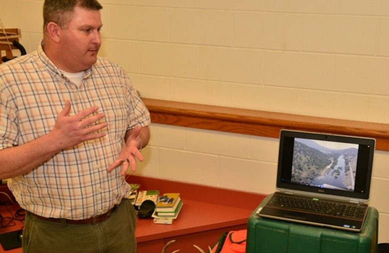 Natural resources program manager Joseph Melton shows students a video of the district's three dam and lake projects. Savannah District Corps of Engineers employees showcase a variety of Corps missions Feb. 25 to approximately 170 engineering students at Jenkins High School in Savannah, Ga. Corps volunteers participated as part of National Engineer Week, held Feb. 22-28, intended to promote technical education and the pursuit of engineering careers to create a diverse and robust engineering workforce. The district partners with the school’s engineering academy to foster interest in the science, technology, engineering, and math fields, also called STEM. This year, students encountered Corps employees holding degrees in a variety of scientific and engineering disciplines. The sample of professions represented a microcosm of the entire workforce whose individual efforts contribute to the Corps’ overall mission
