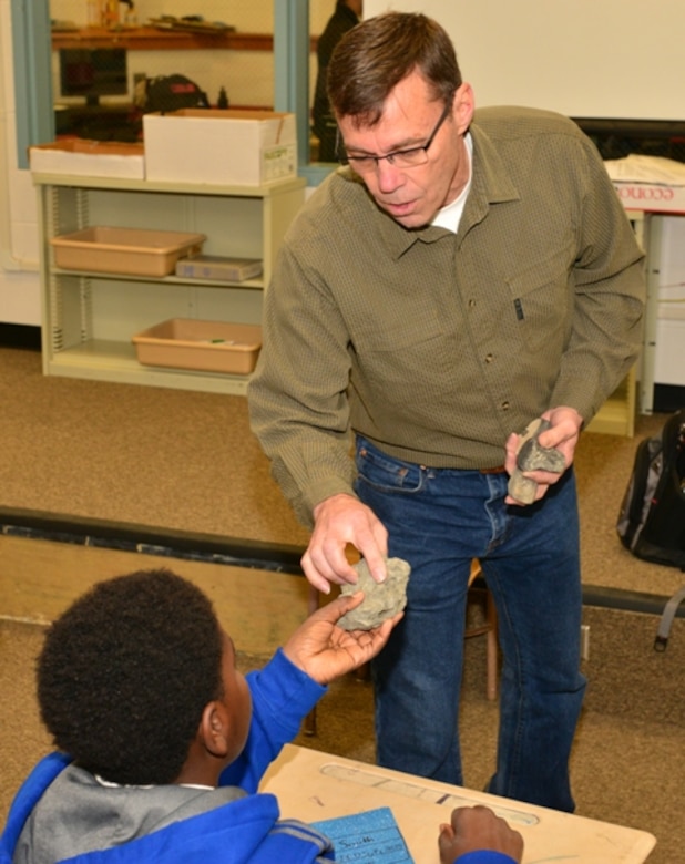 Civil Engineer Stan Simpson shows a Jenkins High School student aquatic artifacts recovered from the Savannah Harbor Feb. 25. Savannah District Corps of Engineers employees showcased a variety of Corps missions to approximately 170 engineering students. Corps volunteers participated as part of National Engineer Week, held Feb. 22-28, intended to promote technical education and the pursuit of engineering careers to create a diverse and robust engineering workforce. The district partners with the school’s engineering academy to foster interest in the science, technology, engineering, and math fields, also called STEM. This year, students encountered Corps employees holding degrees in a variety of scientific and engineering disciplines. The sample of professions represented a microcosm of the entire workforce whose individual efforts contribute to the Corps’ overall mission
