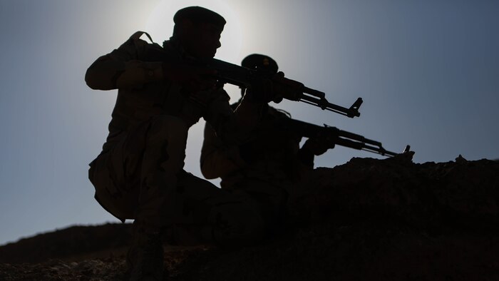 An Iraqi squad leader assigns a soldier his area of responsibility during defense training aboard Al Asad Air Base, Iraq, Feb. 08, 2015. The training gave the soldiers a greater understanding of basic ambush and defense maneuvers. 