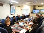 OKINAWA, Japan (Feb 24, 2015) - Rear Adm. Hugh D. Wetherald, Commander, Amphibious Force Seventh Fleet, Rear Adm. Hiroshi Oka, Commander, Mine Warfare Force, Japanese Maritime Self Defense Force (JMSDF), and CAPT. Mike Dowling Commander, Mine Countermeasures Squadron (MCMRON) 7 discuss amphibious and mine warfare during the annual Mine Warfare Staff Talks hosted at Amphibious Force Seventh Fleet Headquarters in White Beach, Okinawa. This year's conference highlighted an increased focus on enhancing combined exercises to better integrate U.S. and Japanese forces and capabilities on a live-force environment. 