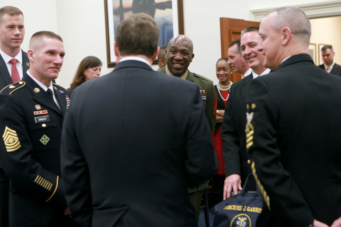 Sergeant Major of the Army Daniel A. Dailey, Sergeant Major of the Marine Corps Ronald L. Green, and Master Chief Petty Officer of the Navy Michael D. Stevens speak to member of Congress prior to a U.S. House of Representatives Military Construction, Veterans Affairs and Related Agencies Subcommittee hearing at the Rayburn House Office Building in Washington, D.C., on Feb. 25, 2015. (U.S. Marine Corps photo by Sgt. Marionne T. Mangrum)