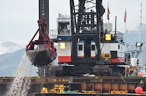 A crane on the Heidi Renee dredges sediment from the Clearwater River. U.S. Army Corps of Engineers photo.