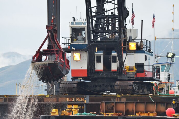 A crane on the Heidi Renee dredges sediment from the Clearwater River. U.S. Army Corps of Engineers photo.