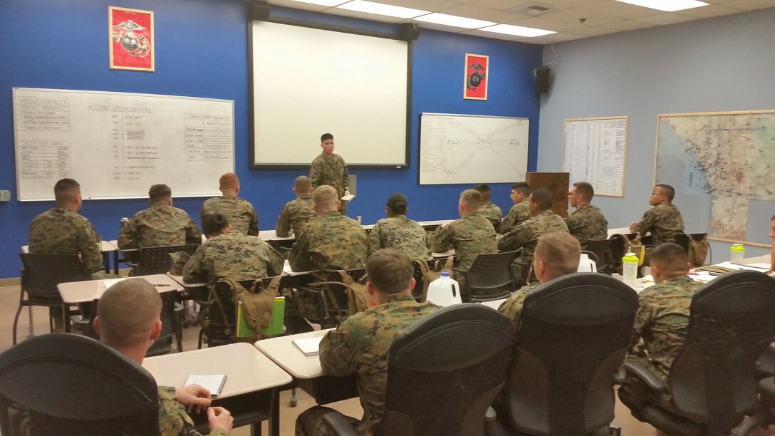 PFC Jacob P. Bunch (front and center) briefing class as the Crew Chief for the first day of simulations.