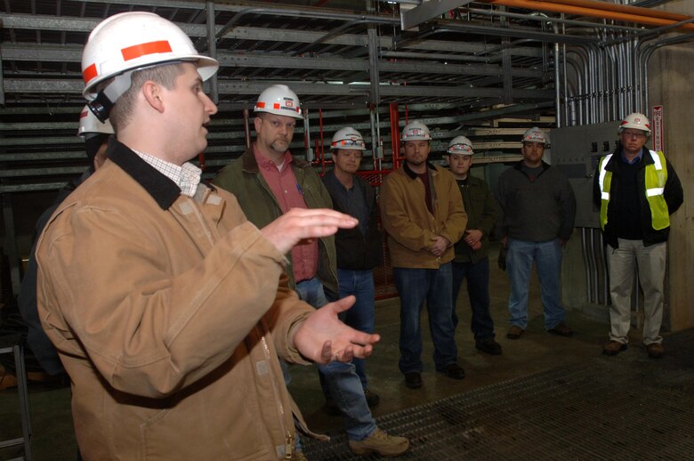 Will Garner, hydropower operator trainee, answers questions during a tour of the Old Hickory Hydropower Plant in Hendersonville, Tenn., Feb. 25, 2015. Participants of the U.S. Army Corps of Engineers Great Lakes and Ohio River Division's Regional Leadership Development Program visited the Nashville District project to learn more about the missions and functions at the dam.