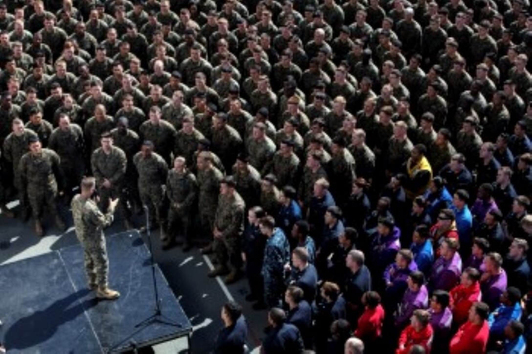 U.S. Marine Maj. Gen. Carl E. Mundy III, left, talks to Marines and Sailors aboard the USS Essex (LHD 2) during Amphibious Squadron/Marine Expeditionary Unit Integration Training (PMINT) at sea Feb. 26, 2015. Mundy is the commander, Task Force 51. Mundy answered questions from the Marines and sailors of the 15th Marine Expeditionary Unit and Essex Amphibious Ready Group about their upcoming deployment. The 15th MEU will fall under Task Force 51 while deployed to the CENTCOM area of responsibility. (U.S. Marine Corps photo by Cpl. Elize McKelvey/Released)