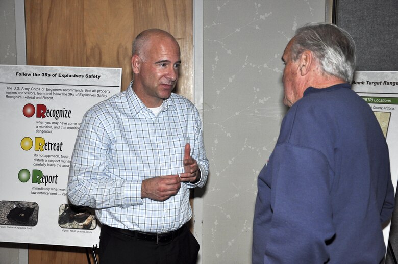 Los Angeles District Formerly Used Defense Sites program manager Jeff Armentrout speaks with a community member during a public meeting in Casa Grande, Arizona, Feb. 25. The meeting was held to present remedial alternatives for the former Williams Field Bomb Target Ranges #4, #9, #10 and #12. The event also marked the opening of the public review and comment period through March 24.