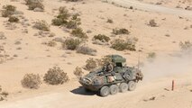 3rd Light Armored Reconnaissance Battalion Marines operate a Light-Armored Vehicle equipped with a new Anti-Tank weapons system to their next objective during testing at range 500 aboard the Combat Center, Feb. 16, 2015. The testing of the new system began Feb. 9 and is scheduled to end March 8.
