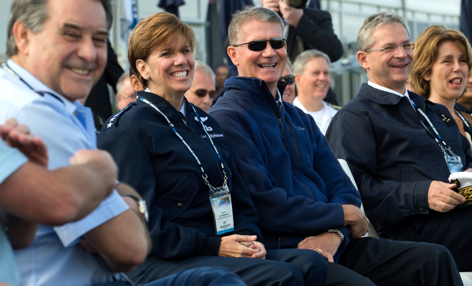 Second from left: U.S. Air Force General Lori Robinson and her husband, retired Maj. Gen. David Robinson laugh at comments during the opening ceremony of the 2015 Australian International Airshow and Aerospace & Defence Exposition at the Avalon Airport, Victoria, Australia, Feb. 24, 2015. The U.S. participates in the Australian International Airshow and other similar events to demonstrate the U.S. focus on regional security and stability and support the rebalance to the Asia-Pacific region. Robinson is the Pacific Air Forces commander. (U.S. Air Force photo/Staff Sgt. Sheila deVera)