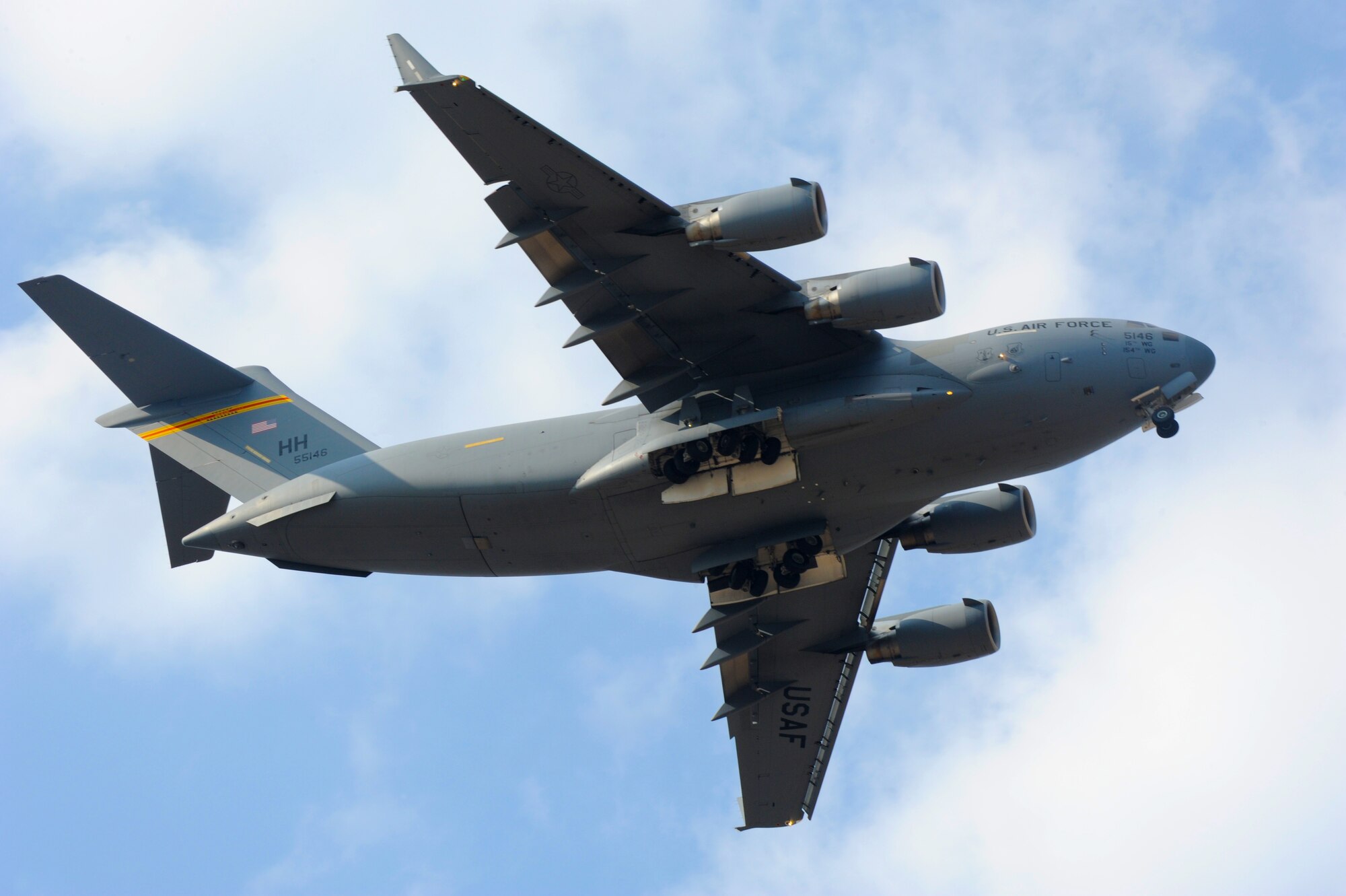 A Pacific Air Forces C-17 Globemaster III displays its landing gear as part of an aerial demonstration during Aero India Feb. 21, 2015 at Air Force Station Yelahanka, Bangaluru, India. Aero India is India's premier aerospace exhibition and airshow and allows the United States to demonstrate its commitment to the security of the Indo-Asia-Pacific region and showcase defense aircraft and equipment, which ultimately contributes toward better regional cooperation and tactical compatibility with other countries.  This year marks the 10th iteration of Aero India since its inception in 1996.  (U.S. Air Force photo 1st Lt Andrea Dykes/Released)