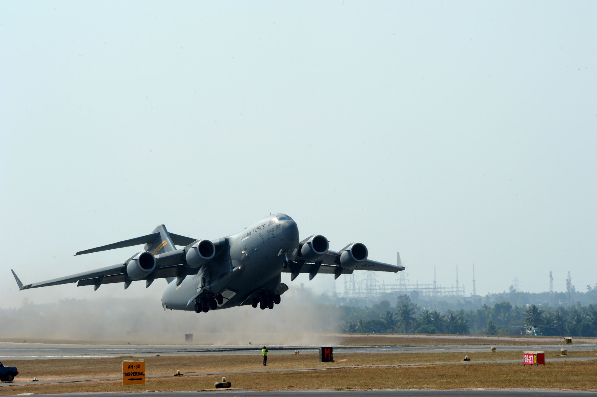 A Pacific Air Forces C-17 Globemaster III takes off for a demonstration flight during Aero India, at Air Force Station Yelahanka, Bengaluru, India, Feb. 18, 2015. Aero India is India's premier aerospace exhibition and airshow and allows the United States to demonstrate its commitment to the security of the Indo-Asia-Pacific region and showcase defense aircraft and equipment, which ultimately contributes toward better regional cooperation and tactical compatibility with other countries.  This year marks the 10th iteration of Aero India since its inception in 1996.  (U.S. Air Force photo by Airman 1st Class Stephen G.Eigel/Released)