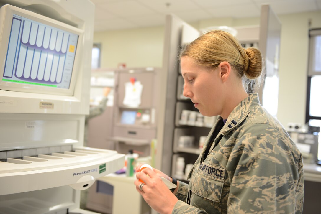 Capt. Kathryn Oja, 36th Medical Group pharmacist, processes a prescription for a patient Feb. 20, 2015, at Andersen Air Force Base, Guam. The pharmacy has processed more than 80 prescriptions since the beginning of this month for Self-Initiated Care Kit patients. (U.S Air Force photo by Airman 1st Class Arielle Vasquez/Released) 