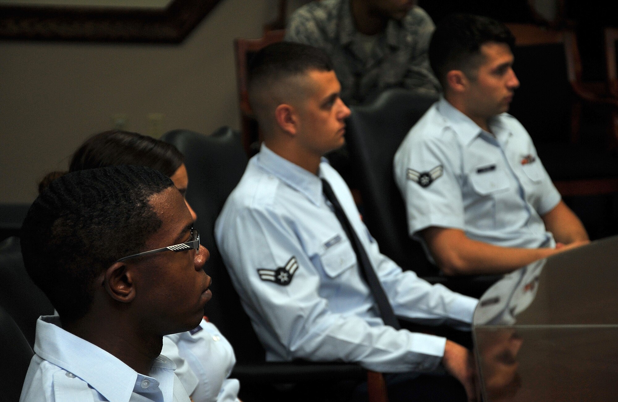 Airmen listen to Brig. Gen. Andrew Toth, 36th Wing commander, provide a mission brief Feb. 9, 2015, at Andersen Air Force Base, Guam, as part of an introduction to the First Term Airmen Center. The FTAC program at Andersen is used as a transition period to get Airmen acclimated to living in a new environment, to learn about the 36th Wing mission, career advancements and give them a chance to communicate with base leadership and be handed the tools for a successful Air Force career. (U.S. Air force photo by Staff Sgt. Melissa B. White/Released)