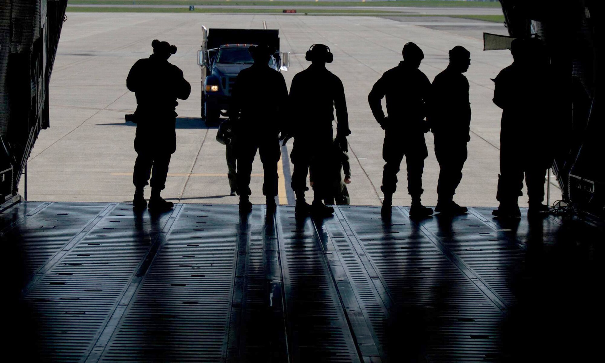 TRAVIS AIR FORCE BASE, Calif. -- 349th Air Mobility Wing members participate in Air Force Specialty Code training Feb.21-22, Travis Air Force Base, Calif. The Aerial Port mission training consisted of aircrew and porters chaining down vehicle cargo, such as a fire truck, inside of a C-5 Galaxy. (U.S. Air Force photos/Senior Airman Madelyn Brown)