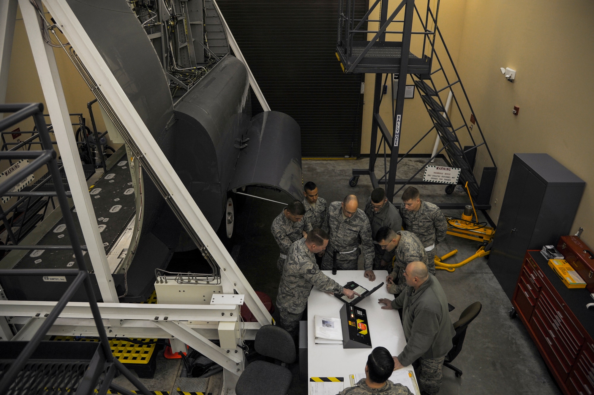 Staff Sgt. Jeffrey Houser, a 373rd Training Squadron Detachment 4 aircraft maintenance field training detachment instructor, reviews instructions on how to change a C-130 tire Feb. 19, 2015, at Little Rock Air Force Base, Ark. The 373rd TRS Detachment 4 supports more than 80 active-duty, Guard, and Reserve C-130 units worldwide through their training. (U.S. Air Force photo by Airman 1st Class Harry Brexel)