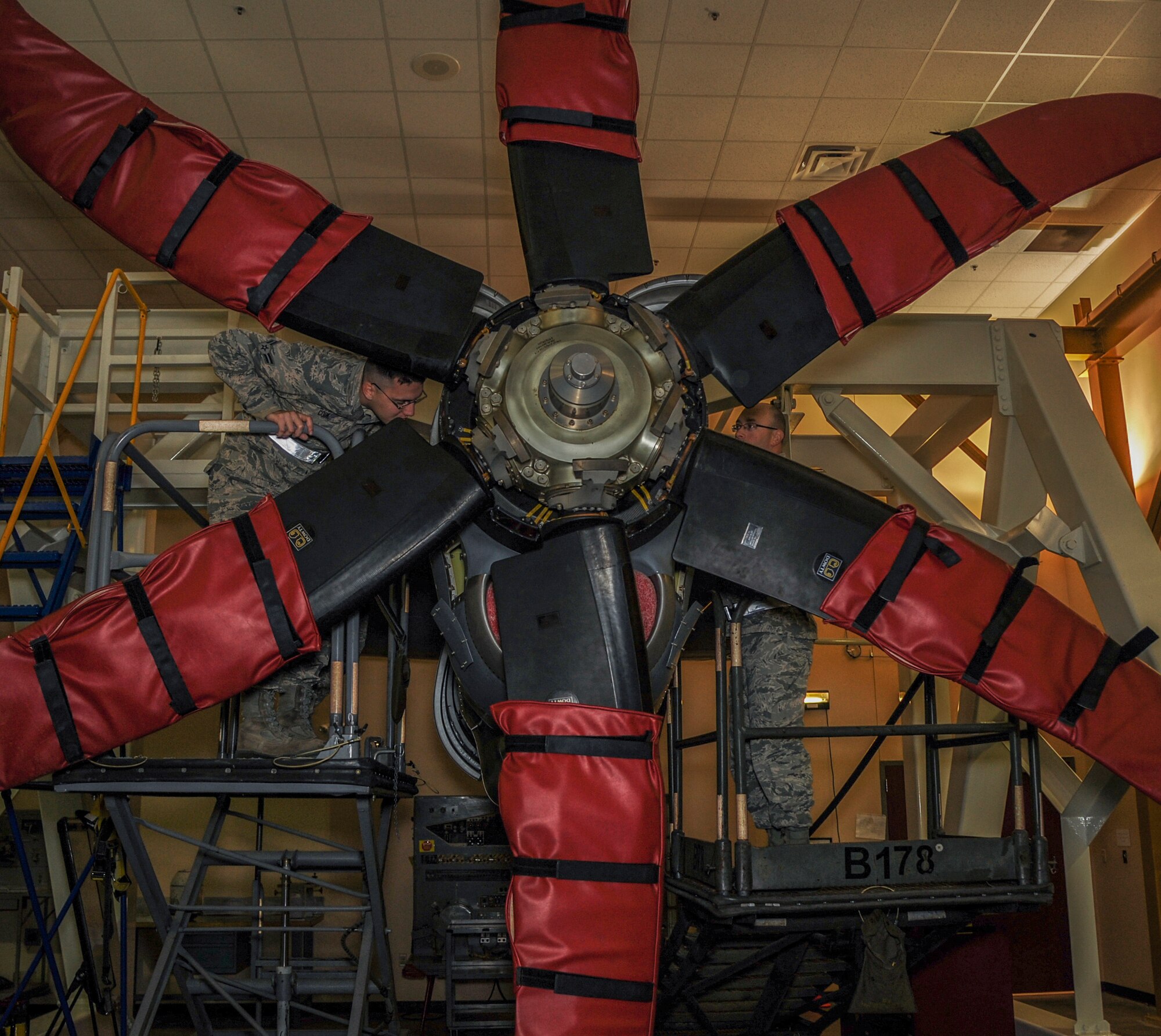 Two Airmen identify basic components of a C-130J propeller engine Feb. 20, 2015, at Little Rock Air Force Base, Ark. The Airmen recently graduated technical school and are learning the ins and outs of C-130 maintenance at the 373rd Training Squadron Detachment 4. (U.S. Air Force photo by Airman 1st Class Harry Brexel) 
