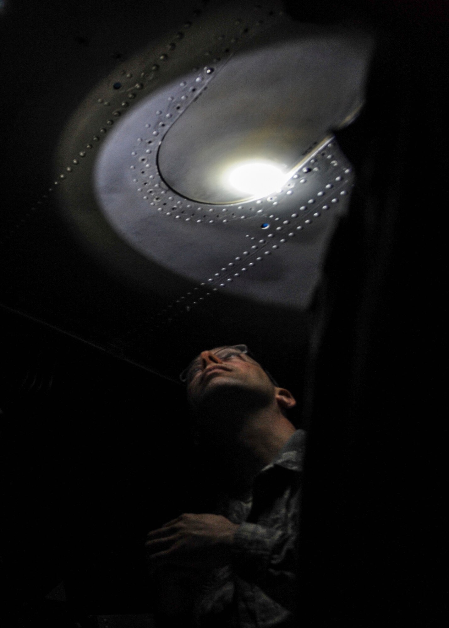 Christopher Cassis, a Connecticut Air National Guard 103rd Maintenance Group aerospace maintenance crew chief, inspects the components of a front landing gear on a C-130 trainer Feb. 20, 2015, at Little Rock Air Force Base, Ark. All active-duty, Guard and Reserve C-130J crew chiefs attend a 19-day course instructed by the 373rd Training Squadron Detachment 4. (U.S. Air Force photo by Airman 1st Class Harry Brexel) 