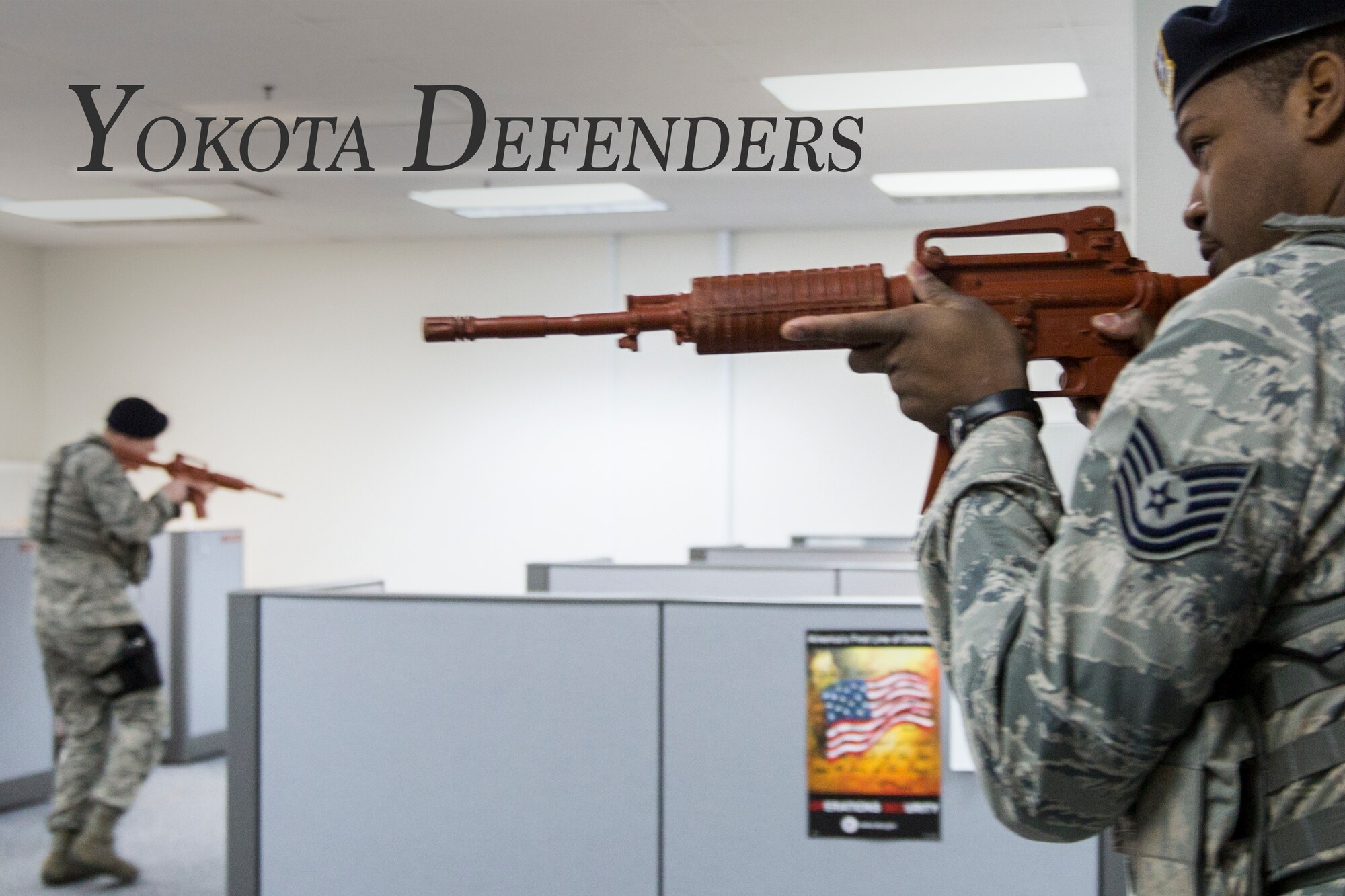 The Defense Finance and Accounting Service Japan in conjunction with the 374th Security Forces Squadron response forces hone their skills during an active shooter training scenario at Yokota Air Base, Japan, Feb. 25, 2015. This joint training exercise provided realism to employees and response forces and tested their reaction and response to an active shooter situation. (U.S. Air Force photo illustration by Osakabe Yasuo/Released)