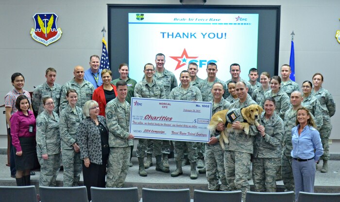 Members of Beale's Combined Federal Campaign committee, the Norcal CFC project director and other supporters pose with a check showing the accumulated amount of donations made in Northern California to the campaign Feb. 24, 2015, at Beale Air Force Base, Calif. Participants donated to thousands of CFC-approved charities, which ranged from local food pantries to international aid organizations (U.S. Air Force photo by Robert Scott/Released)