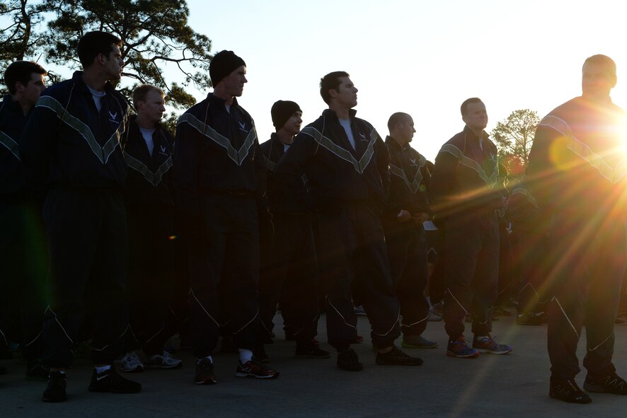 Airmen stand at parade rest after the Comprehensive Airmen Fitness Day 2.3-mile run Feb. 20, 2015, at Moody Air Force Base, Ga. U.S. Air Force Col. Chad Franks, 23d Wing commander, spoke about the importance of CAF Day and the day’s focus, the mental pillar. (U.S. Air Force photo by Airman 1st Class Kathleen D. Bryant)