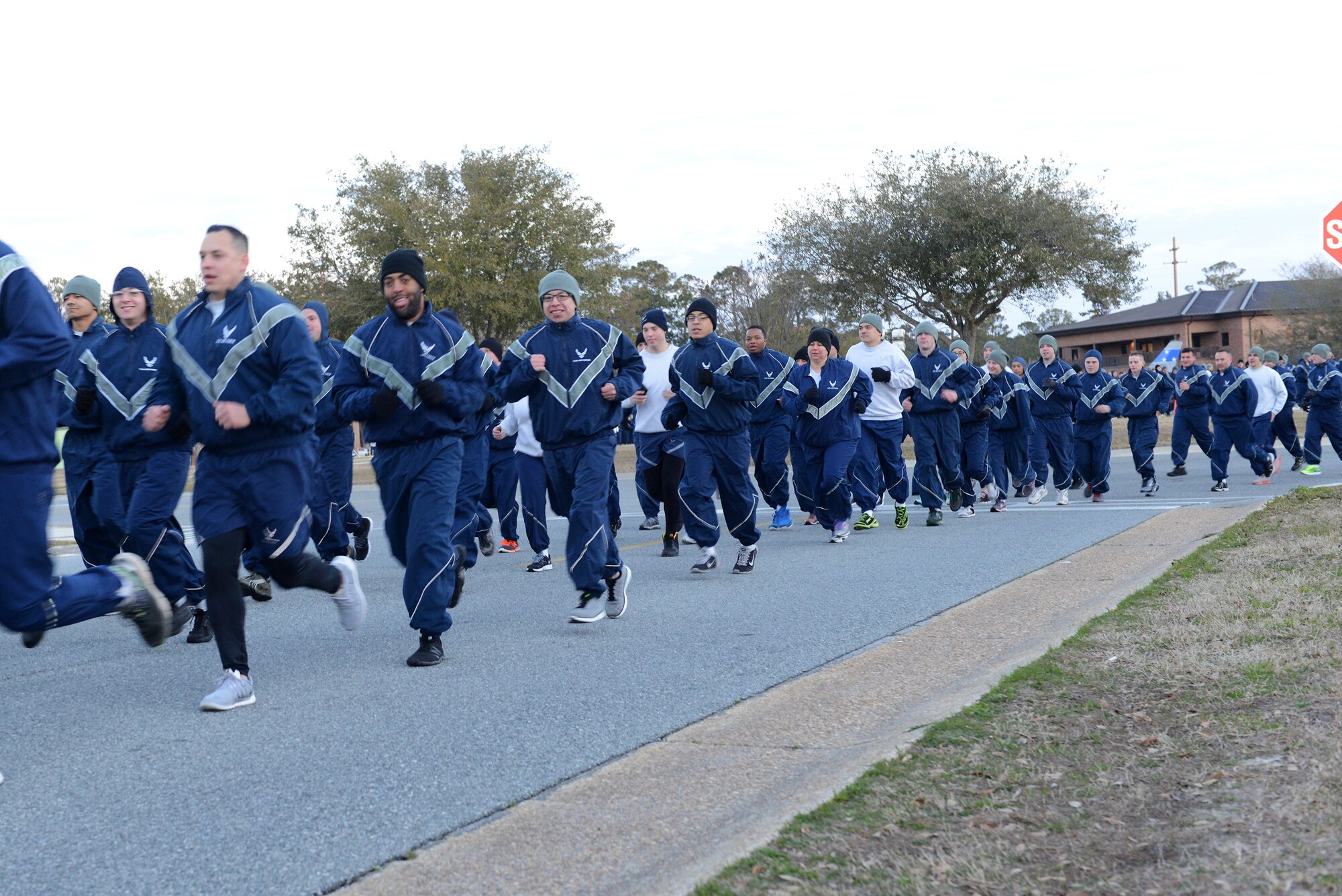 Members of the 23d Wing run 2.3-miles during Comprehensive Airmen Fitness Day Feb. 20, 2015, at Moody Air Force Base, Ga. The Airmen ran in formation with their respective groups. (U.S. Air Force photo by Airman 1st Class Kathleen D. Bryant/Released)
