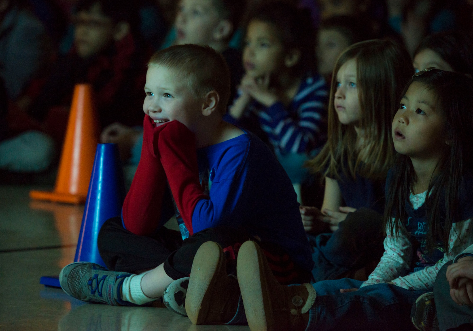Students of Stephensen Elementary watch a video about the origin of the Chinese New Year during an assembly at Mountain Home Air Force Base, Idaho Feb. 23, 2015. The assembly focused on introducing the children to the Singaporean culture. (U.S. Air Force photo by Airman Connor J. Marth/RELEASED)