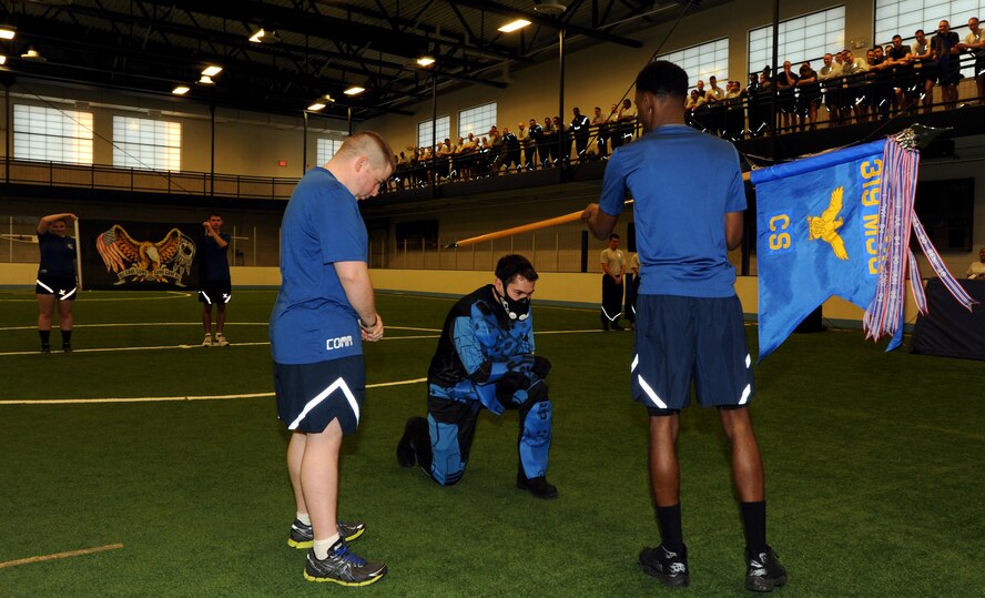 Members of the 319th Communications Squadron perform during the pep rally portion of the 2015 Winter Bash opening ceremonies February 26 at the fitness center on Grand Forks Air Force Base, N.D. Winter Bash, as well as its counterpart, Summer Bash, is an annual event designed to boost morale and esprit de corps. (U.S. Air Force photo/Staff Sgt. Susan L. Davis)