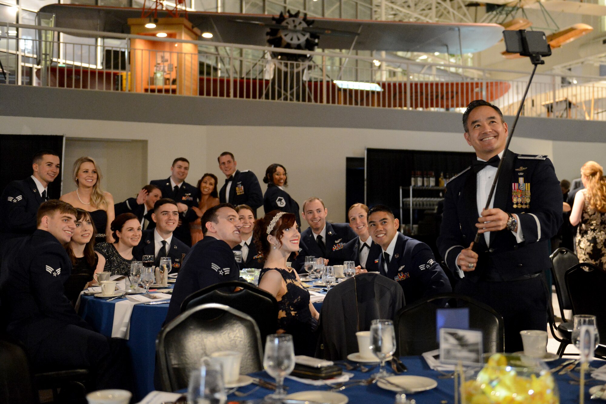 Col. David Kumashiro (right), 62nd Airlift Wing commander, takes a selfie with attendants of the 8th Airlift Squadron’s 75th anniversary Feb. 19, 2015, at Boeing’s Museum of Flight Seattle, Wash. During the event, attendants were able to converse, dance, and have dinner as a squadron along with their guests. (U.S. Air Force photo/Airman 1st Class Keoni Chavarria)