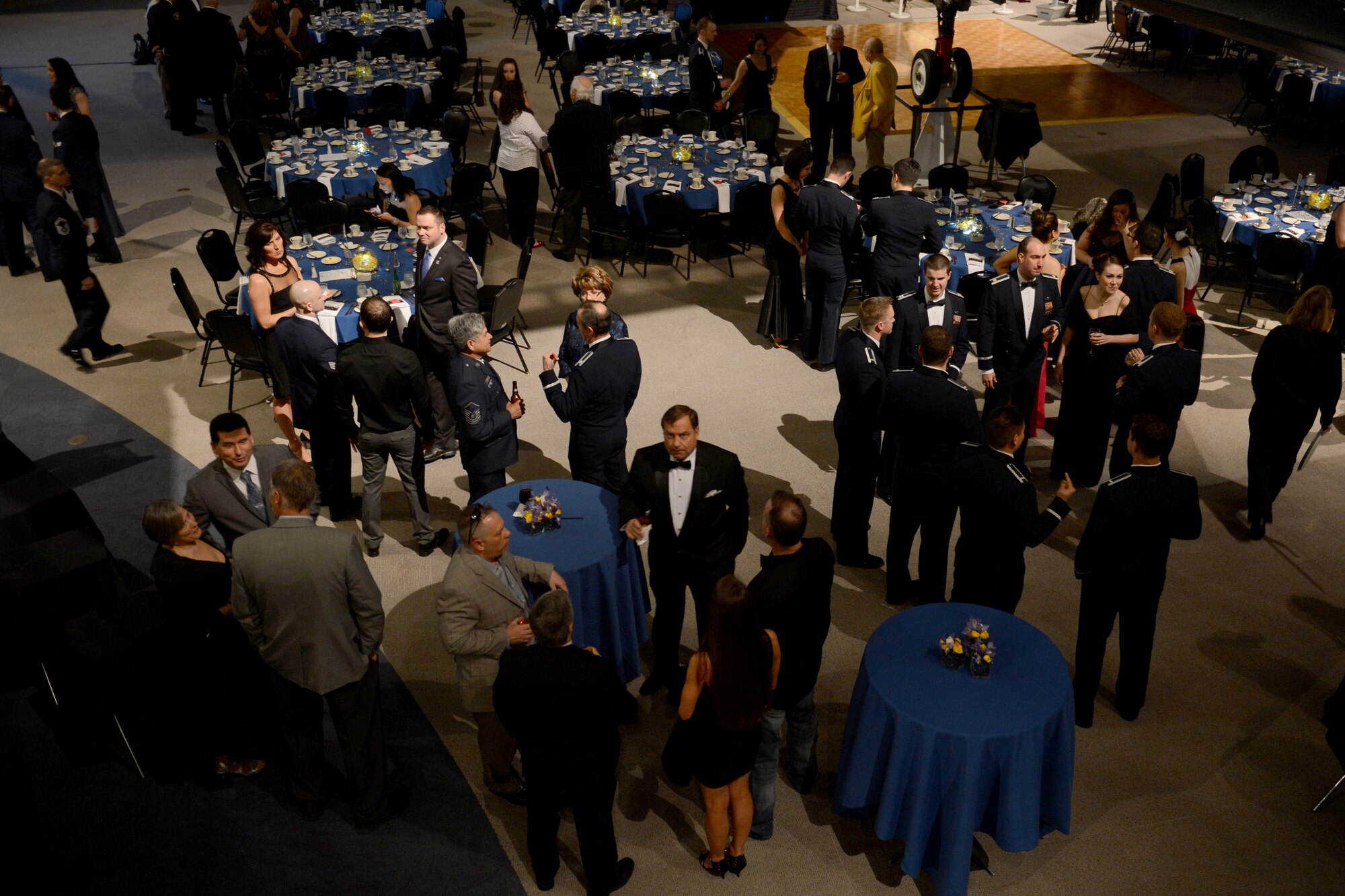 Attendants of the 8th Airlift Squadron’s 75th anniversary converse with one another Feb. 19, 2015, at Boeing’s Museum of Flight Seattle, Wash. The 75th anniversary brought Airmen that are currently assigned to the squadron, and those that were previously assigned together to look back through the squadron’s history. (U.S. Air Force photo/Airman 1st Class Keoni Chavarria)