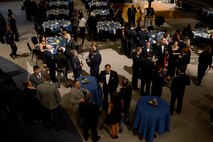 Attendants of the 8th Airlift Squadron’s 75th anniversary converse with one another Feb. 19, 2015, at Boeing’s Museum of Flight Seattle, Wash. The 75th anniversary brought Airmen that are currently assigned to the squadron, and those that were previously assigned together to look back through the squadron’s history. (U.S. Air Force photo/Airman 1st Class Keoni Chavarria)